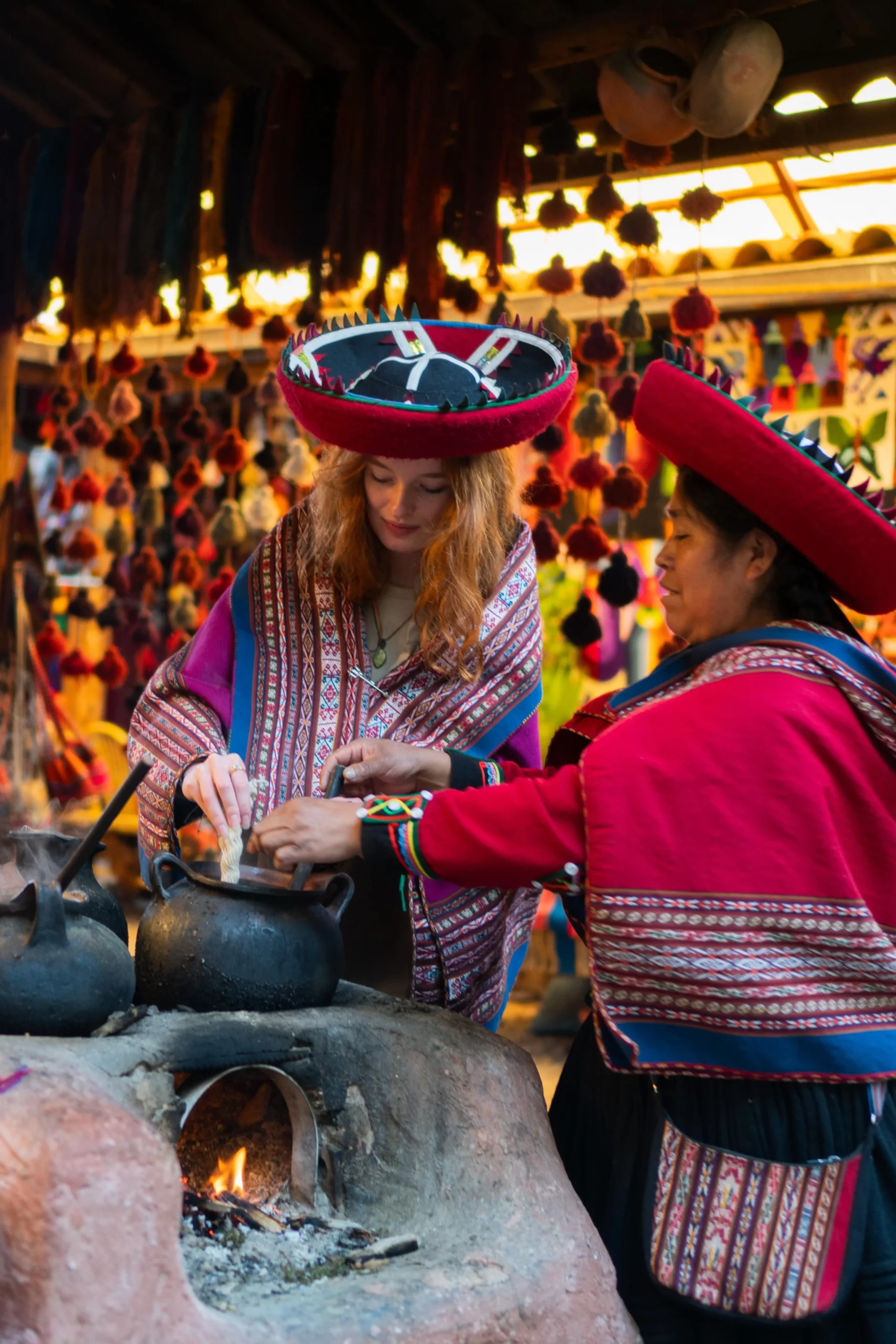 Tourist learning about local textiles at a traditional market in Chinchero.