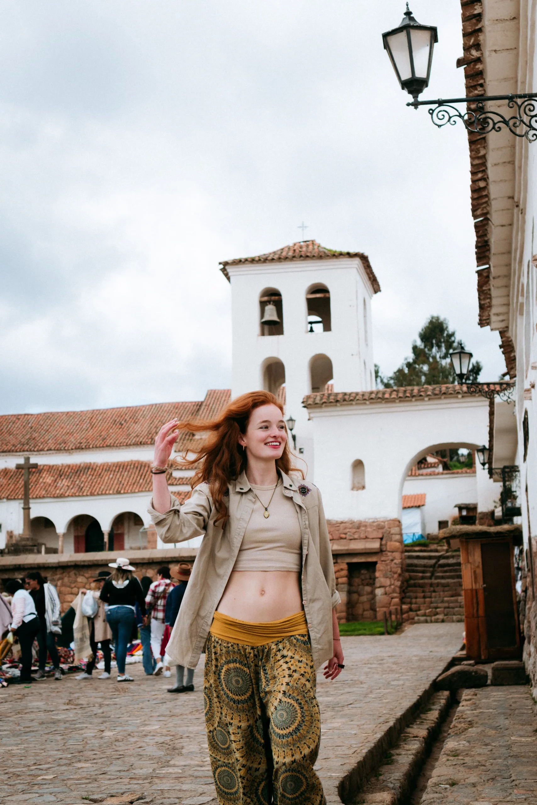 Traveler exploring the historic church of Chinchero during a cultural visit.