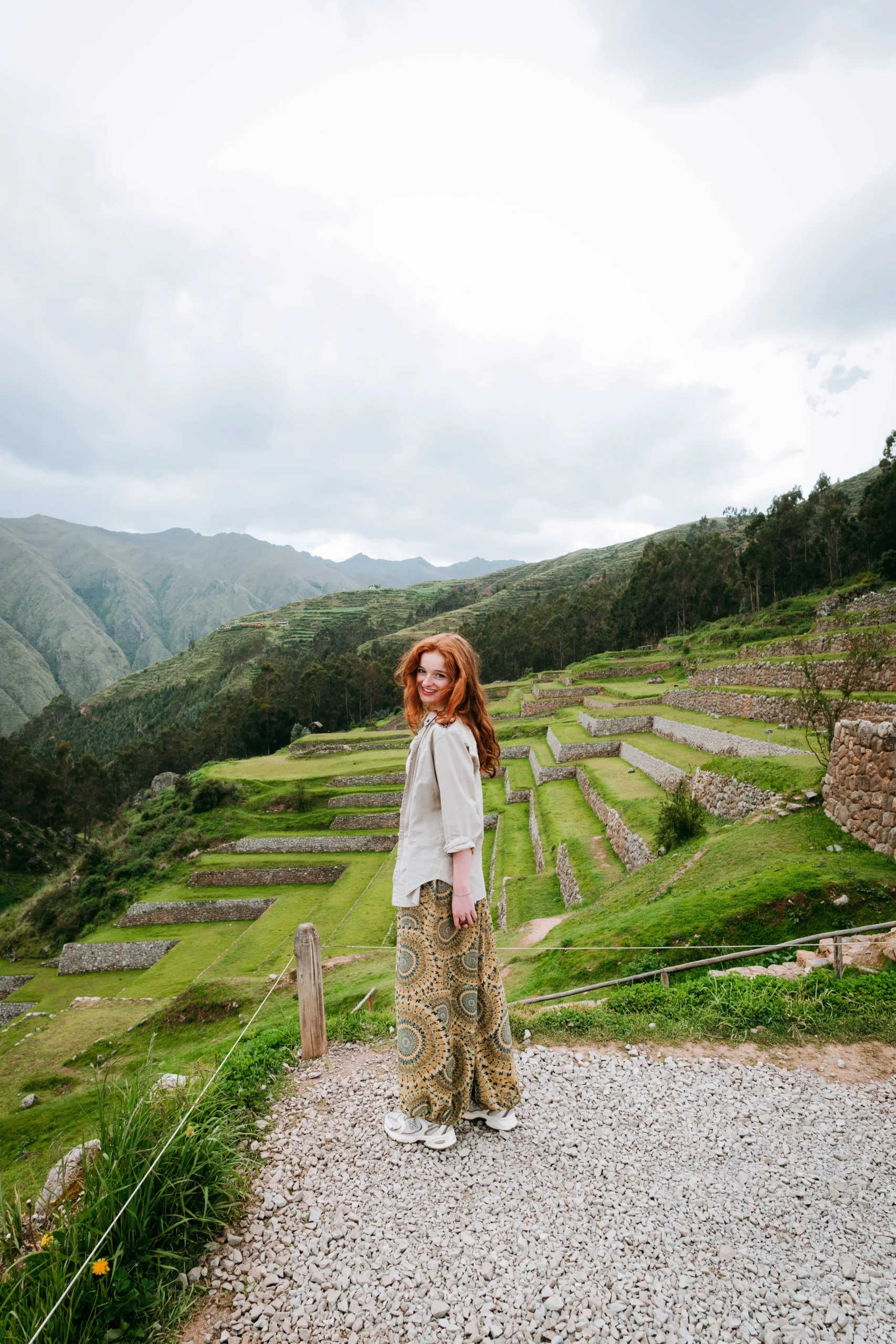 Woman enjoying the scenic agricultural terraces of Chinchero, Peru.