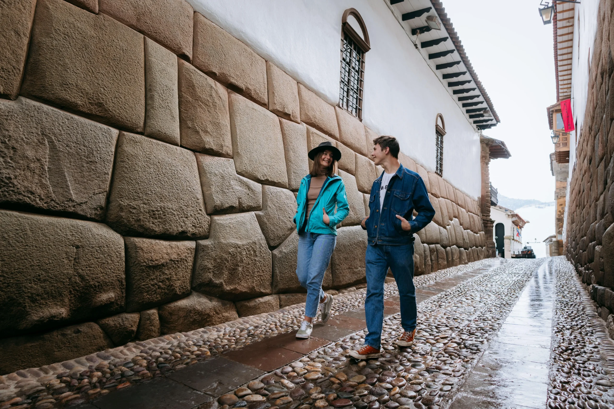 Traveler exploring the cobbled streets of Cusco City,this is the street of the 12-angled stone.