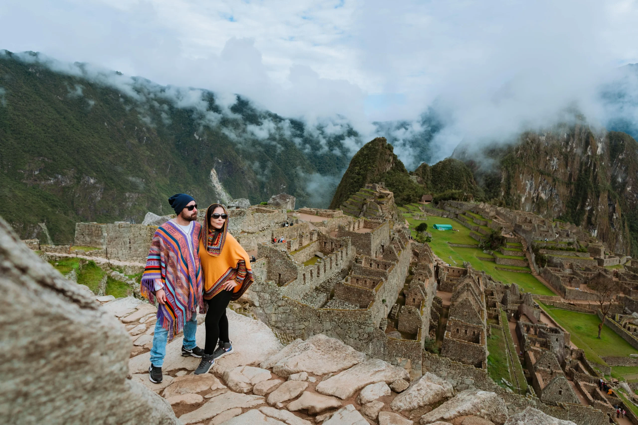 Travelers exploring the ancient ruins of Machu Picchu