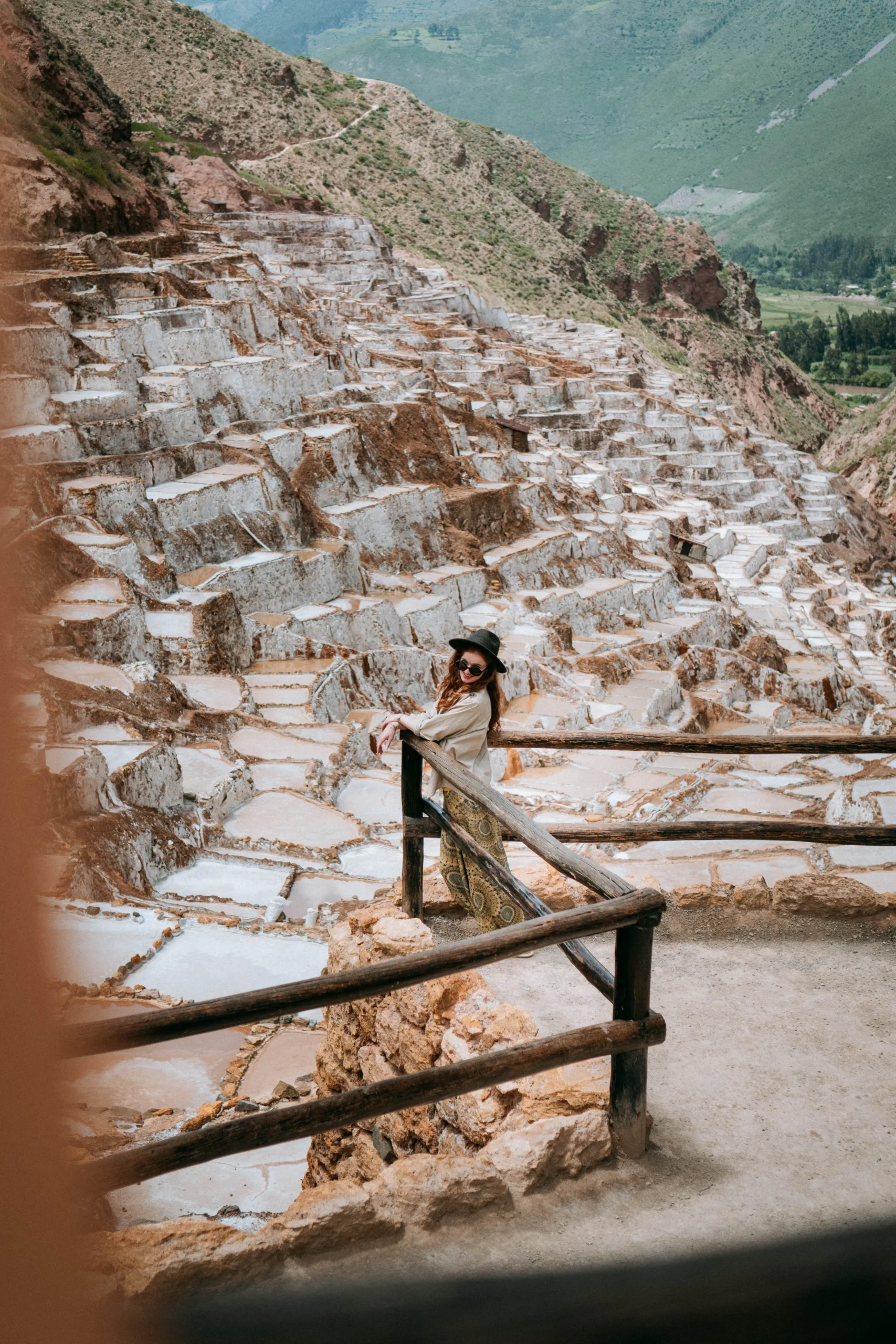 Traveler exploring the Maras Salt Mines in the Sacred Valley