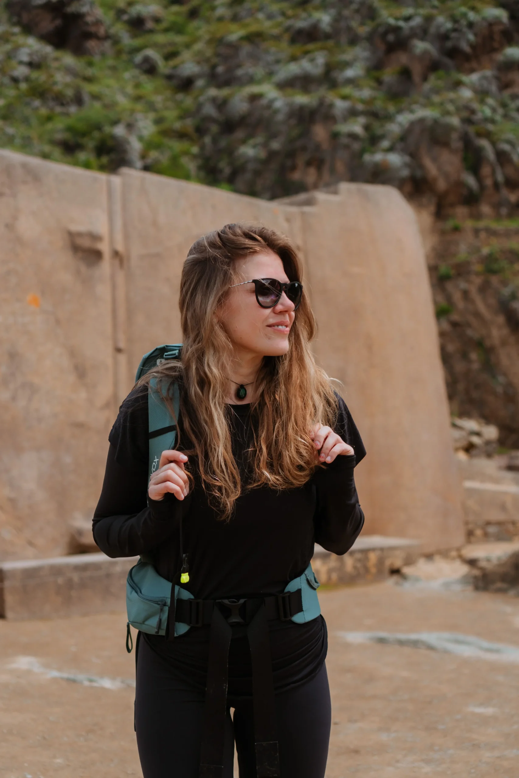 Backpacker exploring Ollantaytambo archaeological site